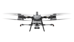 DJI Agras T100 agricultural spray drone in flight over a Texas field